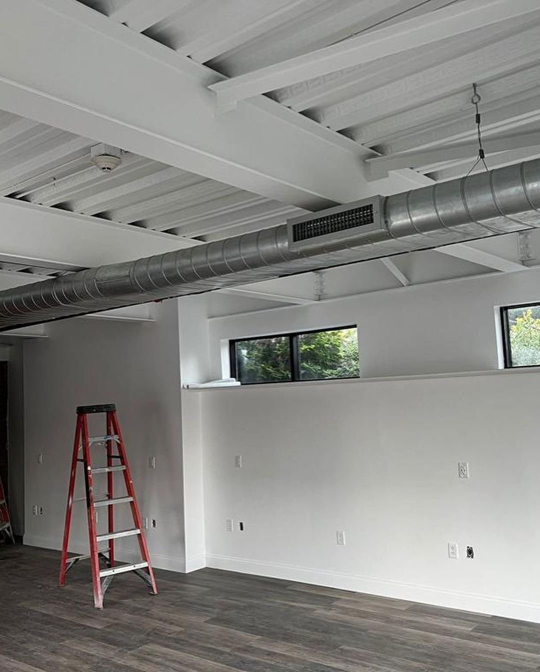 Finished commercial space with exposed spiral ductwork